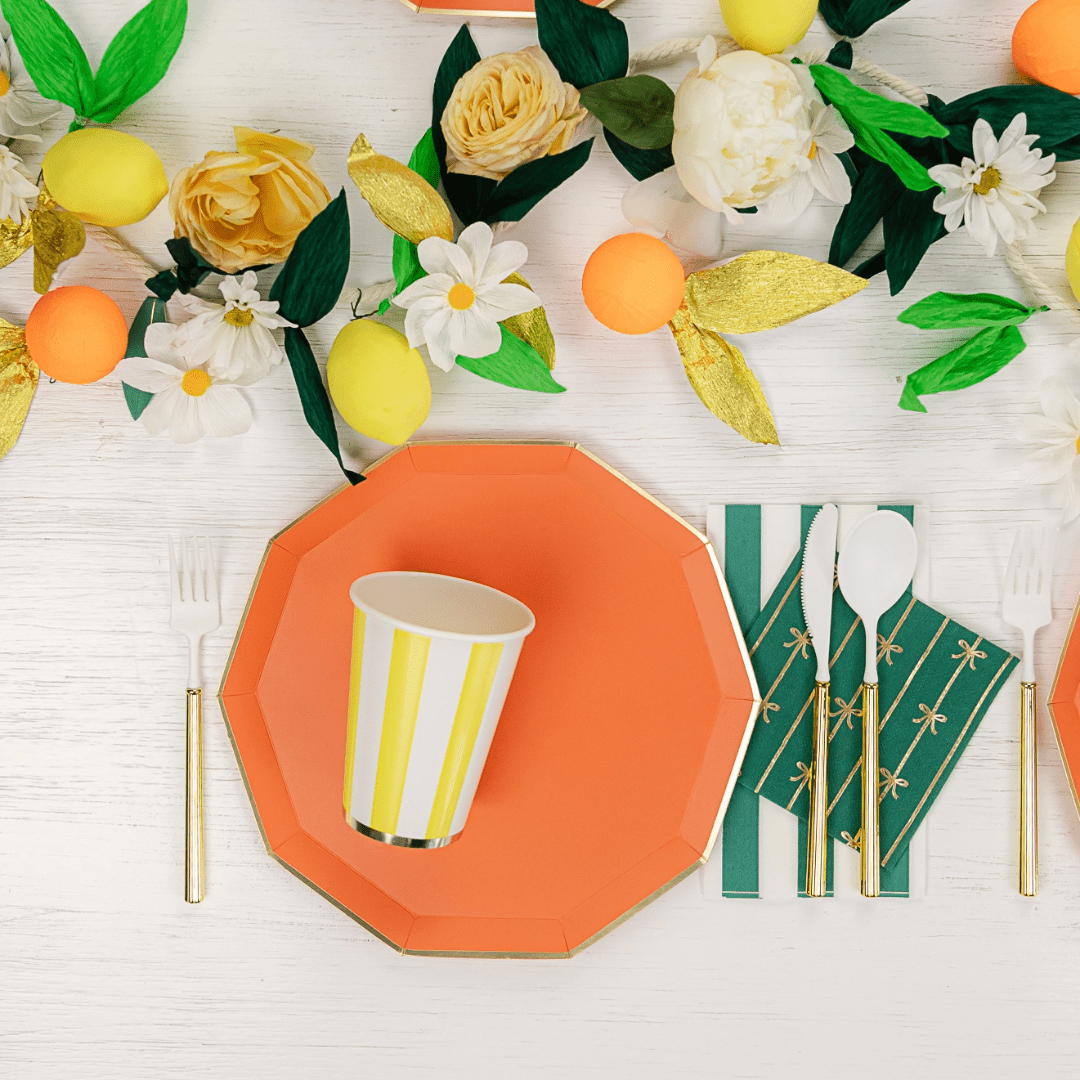 orange plate yellow striped cup and floral table setting lemon theme from Parte Haus party supply store in Bethesda MD