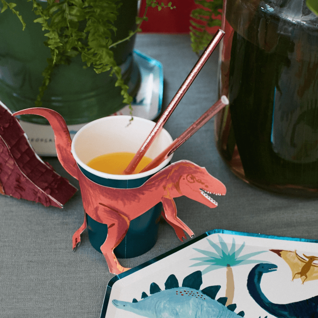 Red dinosaur themed paper cup with tail and legs perfect for kids birthday from Parte Haus party supply store in Bethesda MD