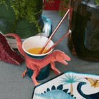 Red dinosaur themed paper cup with tail and legs perfect for kids birthday from Parte Haus party supply store in Bethesda MD