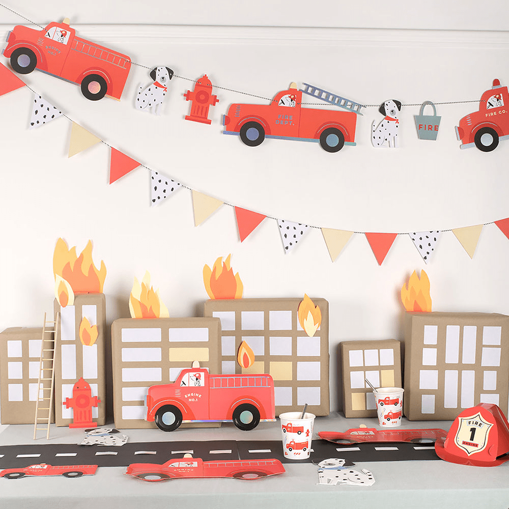 Red firetruck birthday table decorations and cityscape theme for kids from Parte Haus party supply store in Bethesda Maryland