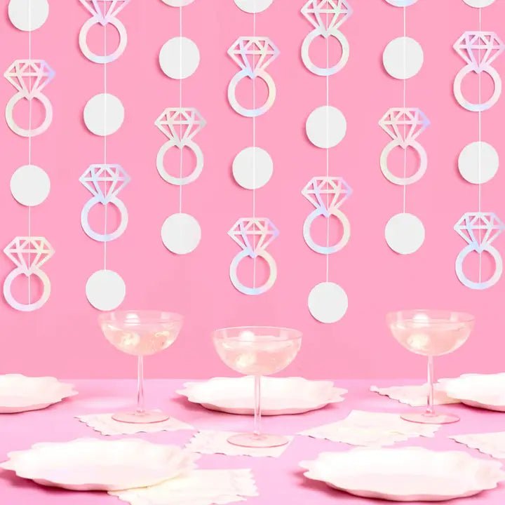Iridescent ring garland bridal shower backdrop pink table setting from Parte Haus party supply store in Bethesda MD.