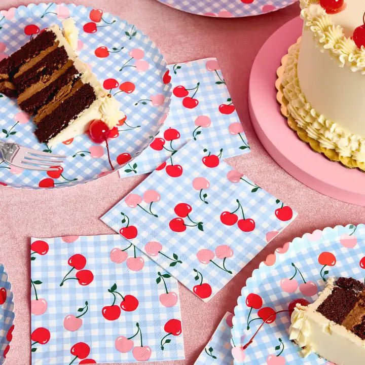 Blue cherry picnic plates and napkins with cake from Parte Haus party supply store in Bethesda Maryland