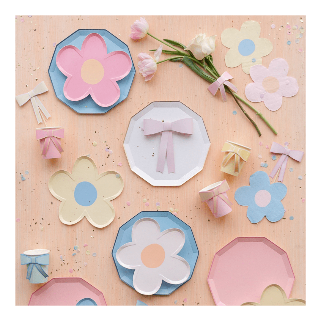 Pastel floral and bow paper plates and cups birthday theme from Parte Haus party supply store in Bethesda MD.