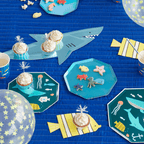 Blue ocean themed kids birthday tableware with shark shaped plates from Parte Haus party supply store in Bethesda MD.