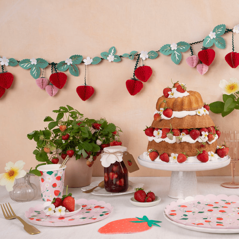 Red and green strawberry party table garland summer birthday setup from Parte Haus party supply store in Bethesda MD