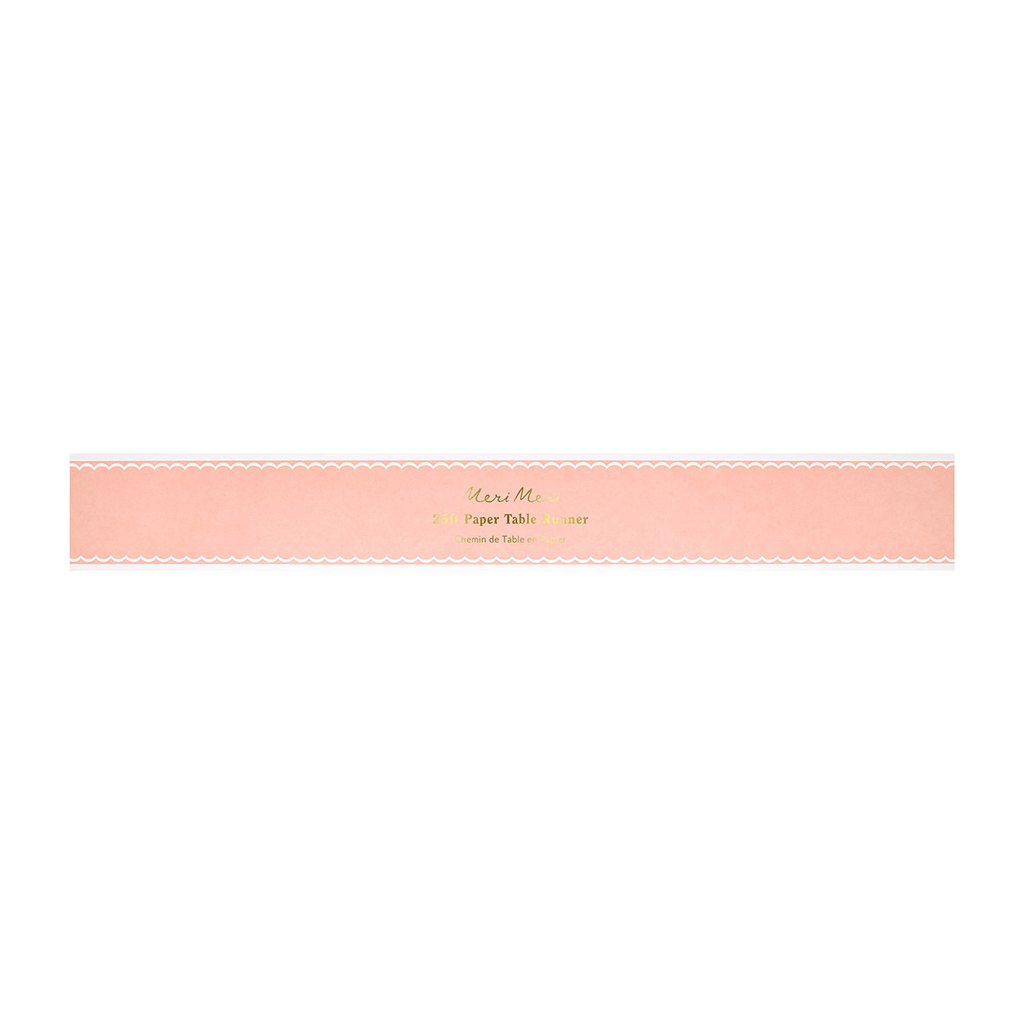 Pink paper table runner with scalloped edges for elegant celebrations from Parte Haus party supply store in Bethesda MD.