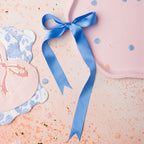 Blue ribbon pink and floral napkins with confetti baby shower from Parte Haus party supply store in Bethesda MD