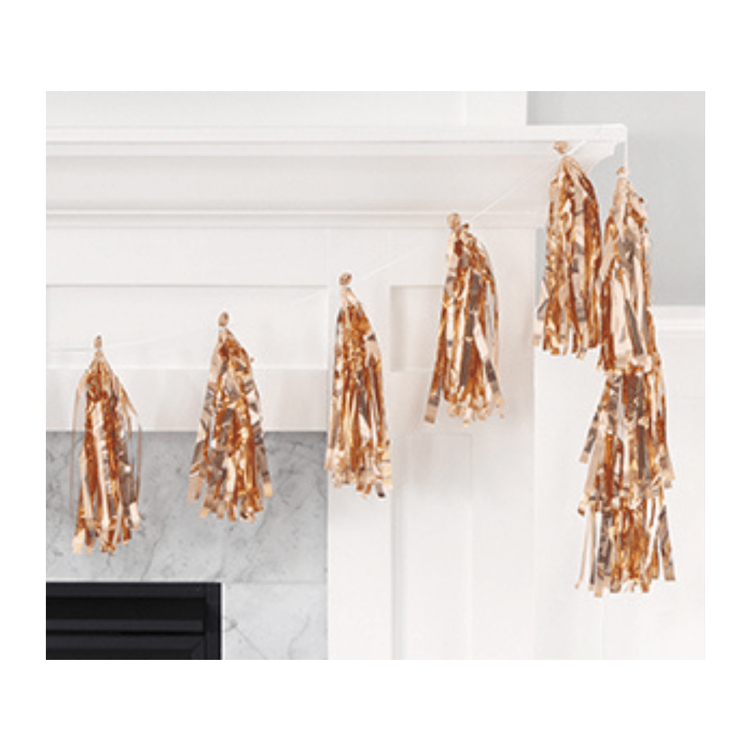 Gold metallic tassel garland festive decoration for celebration from Parte Haus party supply store in Bethesda Maryland.