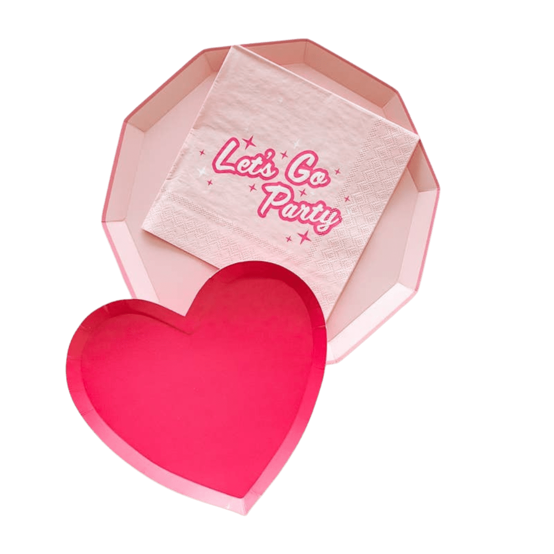Pink heart shaped plate and napkin set for celebration theme from Parte Haus party supply store in Bethesda MD.