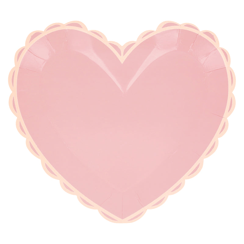 Pink heart shaped plate with scalloped edge for Valentine theme from Parte Haus party supply store in Bethesda MD.