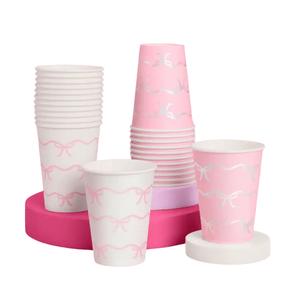 Pink and white paper cups with bow design for birthday from Parte Haus party supply store in Bethesda MD