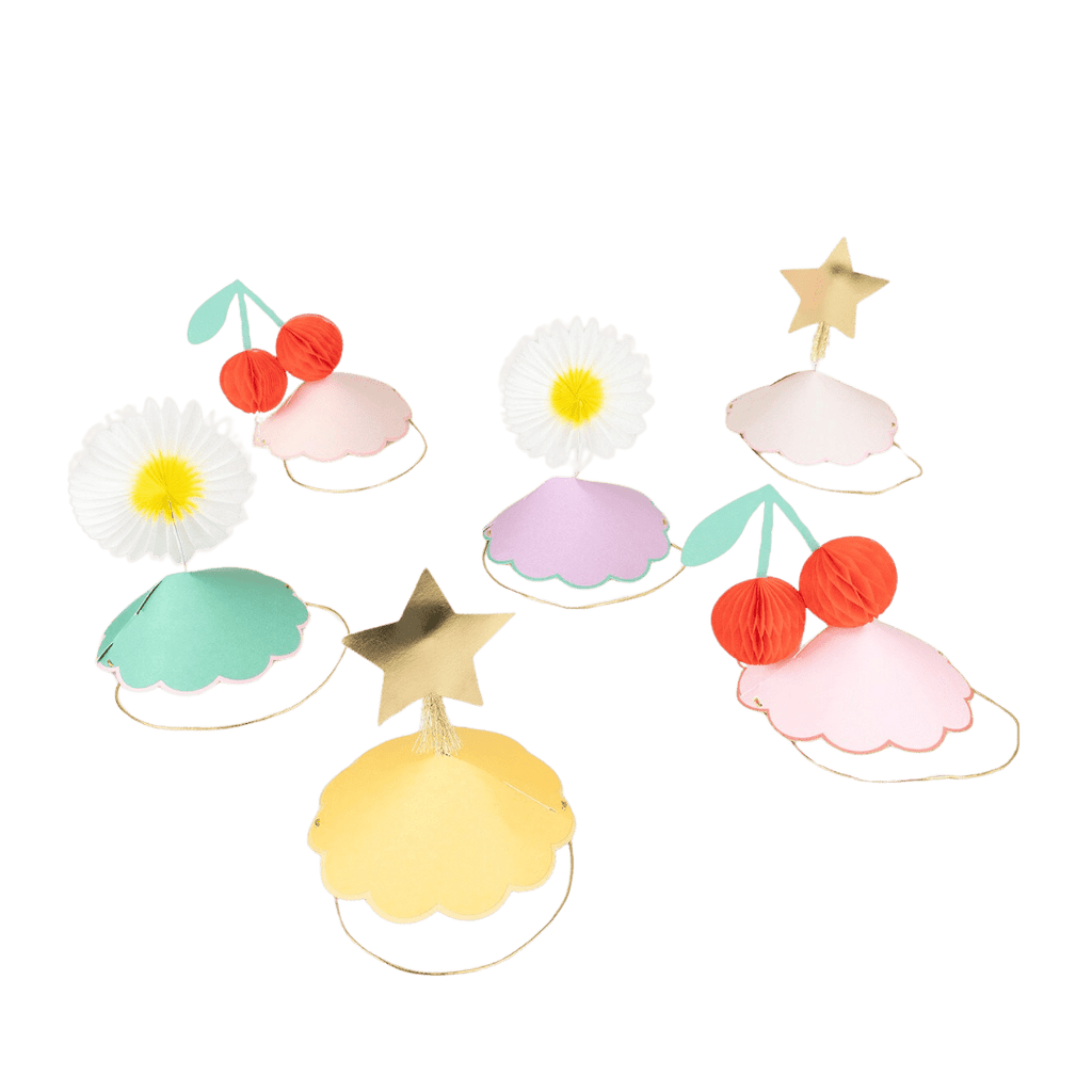 Pastel paper party hats with daisy star and cherry designs for birthday from Parte Haus party supply store in Bethesda MD