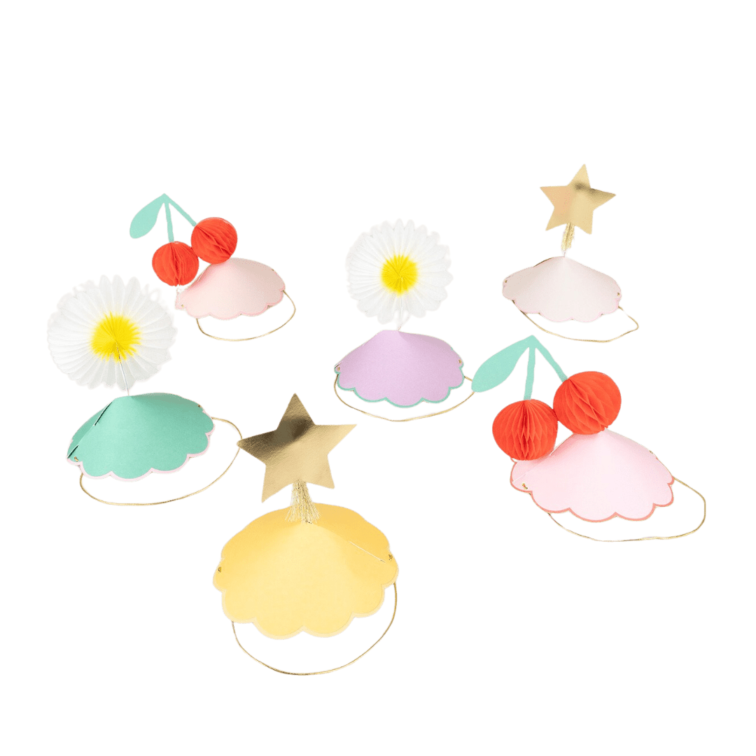 Pastel paper party hats with daisy star and cherry designs for birthday from Parte Haus party supply store in Bethesda MD
