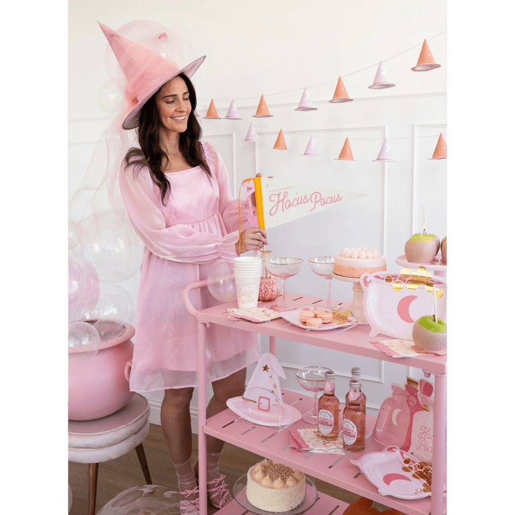 Pink witch theme decor and tableware with desserts for Halloween from Parte Haus party supply store in Bethesda Maryland