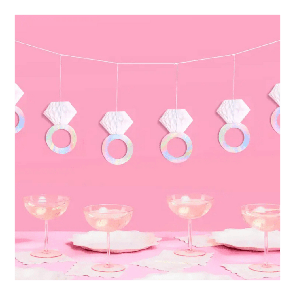 Iridescent diamond ring garland and coupe glasses for bridal shower from Parte Haus party supply store in Bethesda Maryland