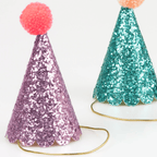 Purple and teal glitter cone hats with pom poms birthday theme from Parte Haus party supply store in Bethesda MD