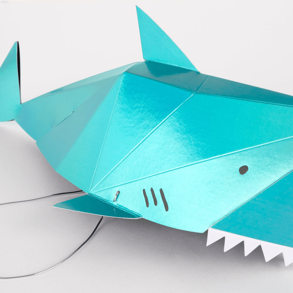Teal shark shaped paper garland for ocean theme birthday from Parte Haus party supply store in Bethesda MD