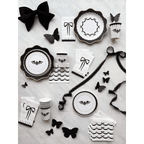Black and white Halloween tableware with bat and bow designs gothic theme from Parte Haus party supply store in Bethesda MD