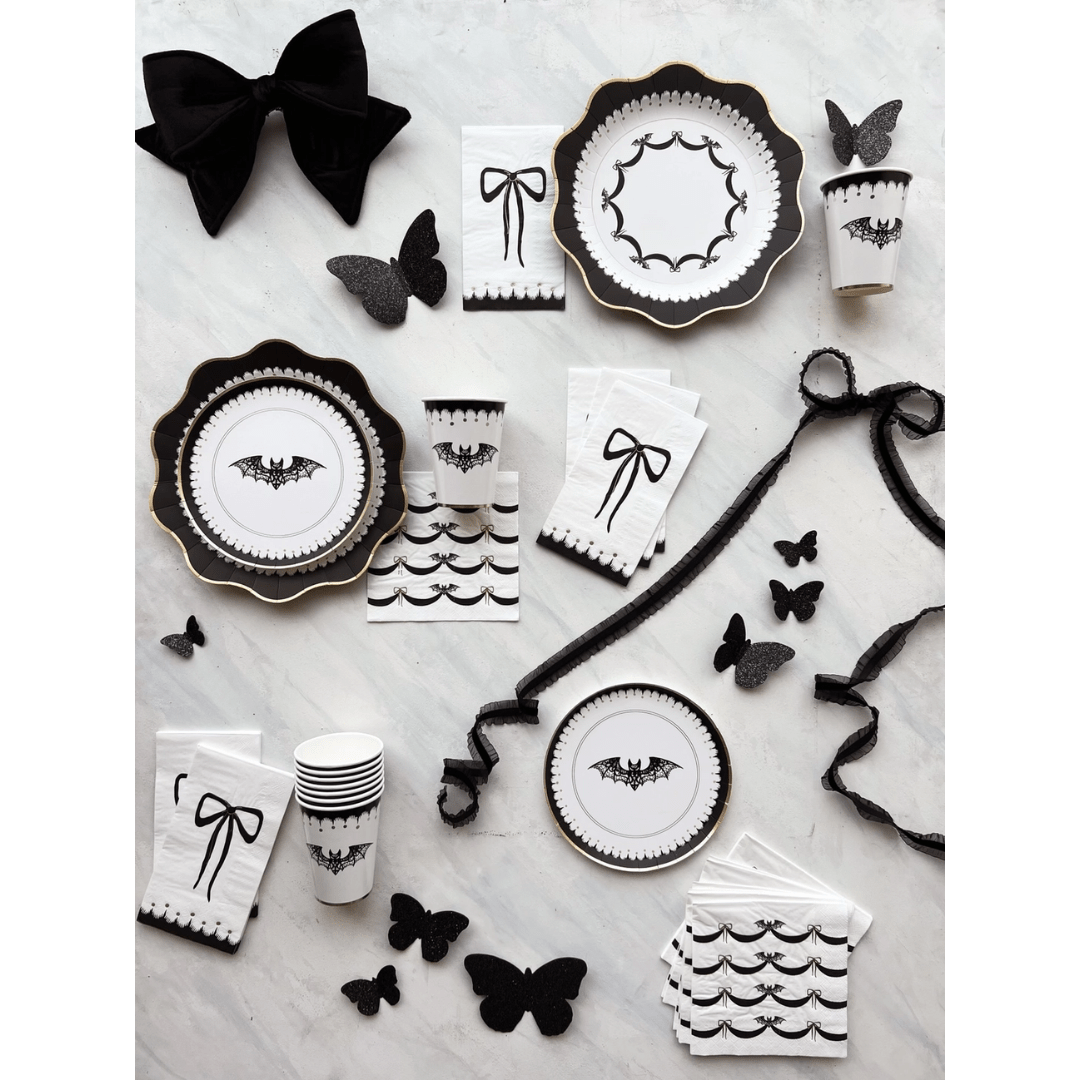 Black and white Halloween tableware with bat and bow designs gothic theme from Parte Haus party supply store in Bethesda MD