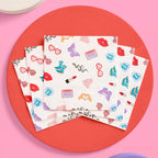 Colorful printed napkins with hearts lips butterflies and dice for celebration from Parte Haus party supply store in Bethesda Maryland