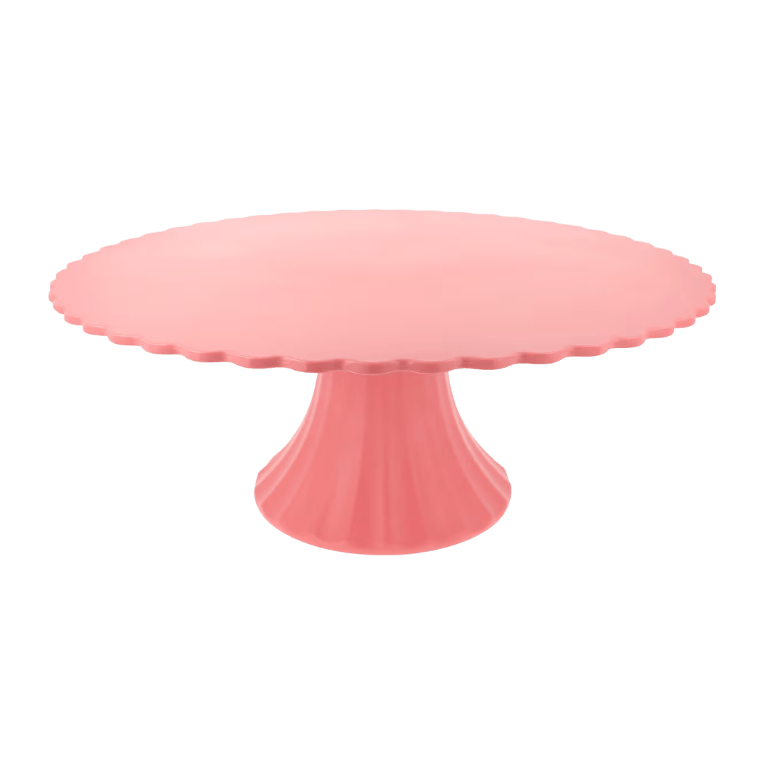 Pink cake stand with scalloped edge for birthday celebration from Parte Haus party supply store in Bethesda MD.