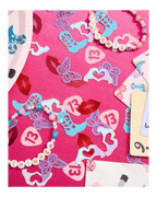 Pink and blue confetti and beaded bracelets birthday theme from Parte Haus party supply store in Bethesda MD