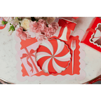 Red and pink peppermint swirl plate with scalloped placemat holiday table decor from Parte Haus party supply store in Bethesda MD