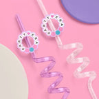 Pink and purple swirl straw fun drinkware with Party Era beads birthday theme from Parte Haus party supply store in Bethesda Maryland