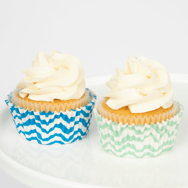 Blue and green striped cupcake wrappers with vanilla cupcakes birthday theme from Parte Haus party supply store in Bethesda MD.