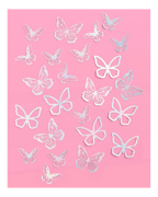 White butterfly wall decals with delicate cutout shapes for birthday decor from Parte Haus party supply store in Bethesda MD.