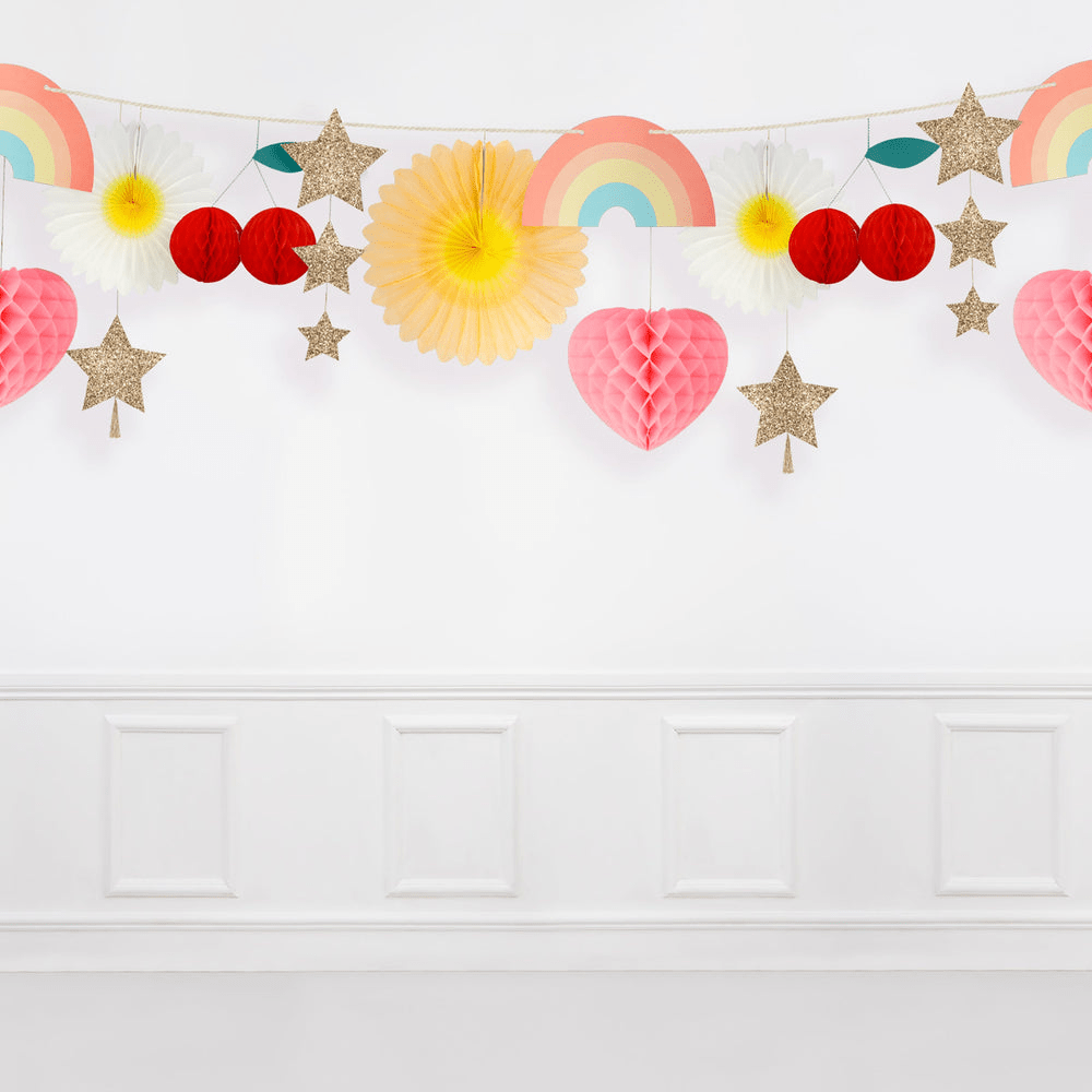 Multicolor garland and hanging decorations with rainbows hearts stars and fans for birthday from Parte Haus party supply store in Bethesda Maryland