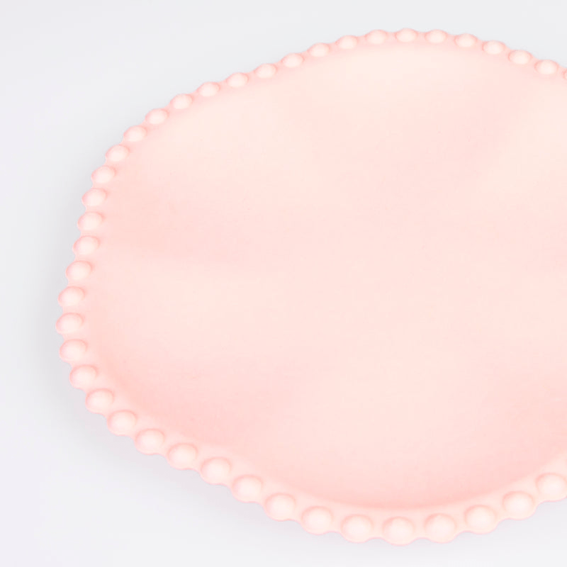 Pink scalloped edge plate with raised dots birthday theme from Parte Haus party supply store in Bethesda MD.