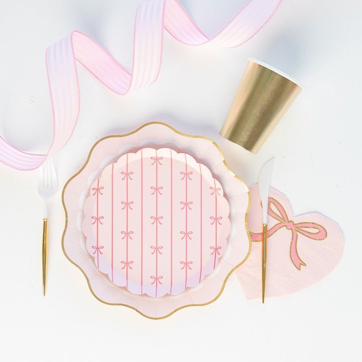 Pink and gold scalloped plate with ribbon pattern birthday tableware for girls theme from Parte Haus party supply store in Bethesda Maryland