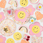 Colorful pastel flower plate set with rainbows and smiley faces birthday theme from Parte Haus party supply store in Bethesda MD