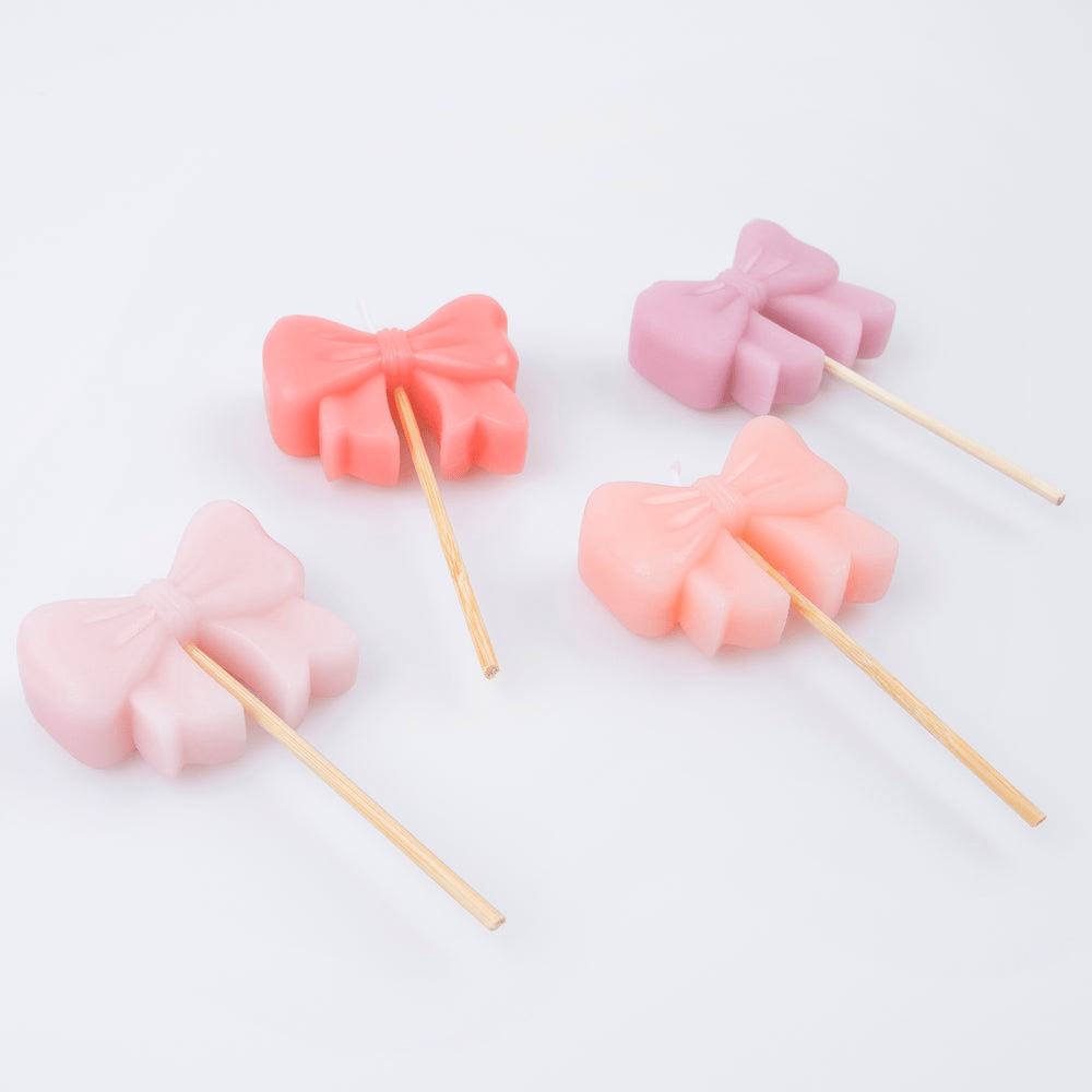 Pink and purple bow cake toppers with sticks for birthday from Parte Haus party supply store in Bethesda MD