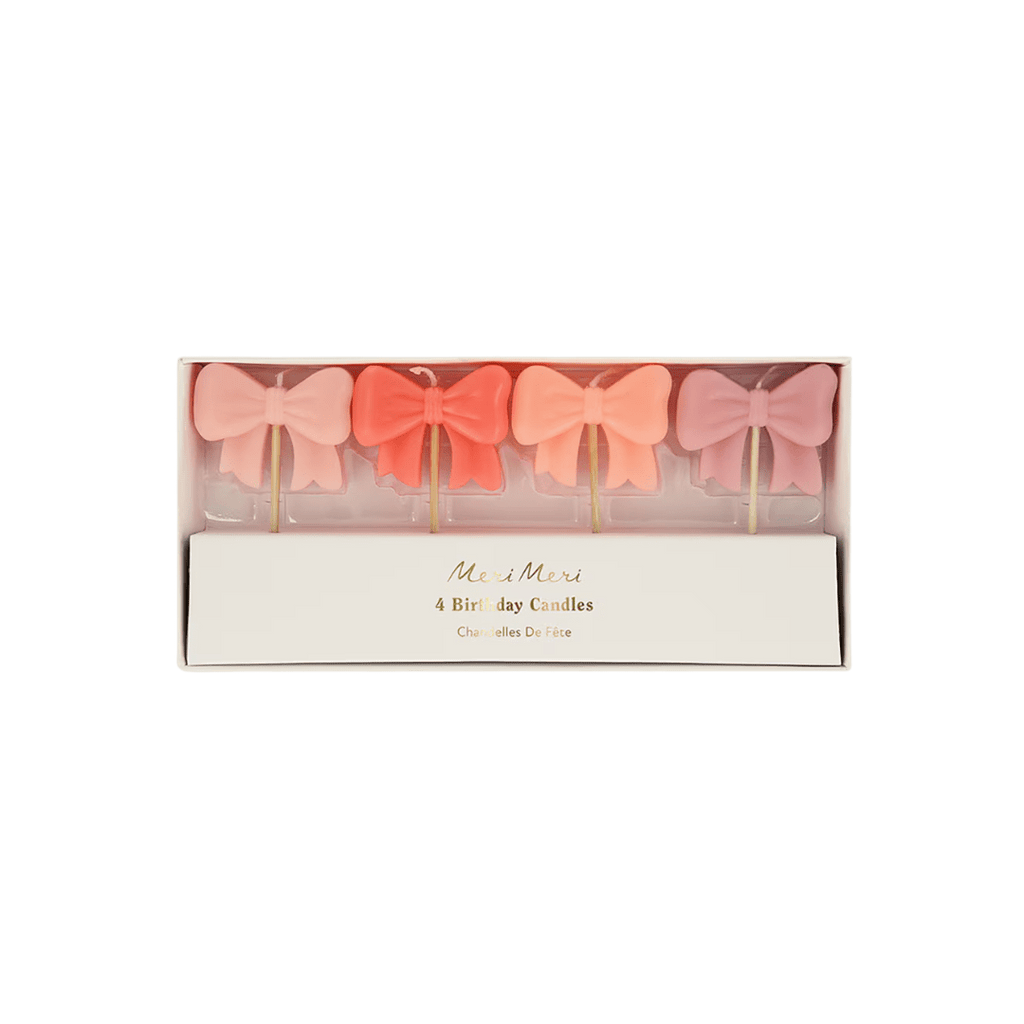 Pink bow birthday candles in a gift box for birthday theme from Parte Haus party supply store in Bethesda Maryland