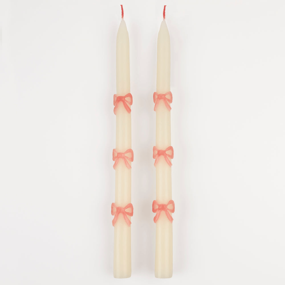 Cream taper candles with pink bows elegant decor from Parte Haus party supply store in Bethesda MD