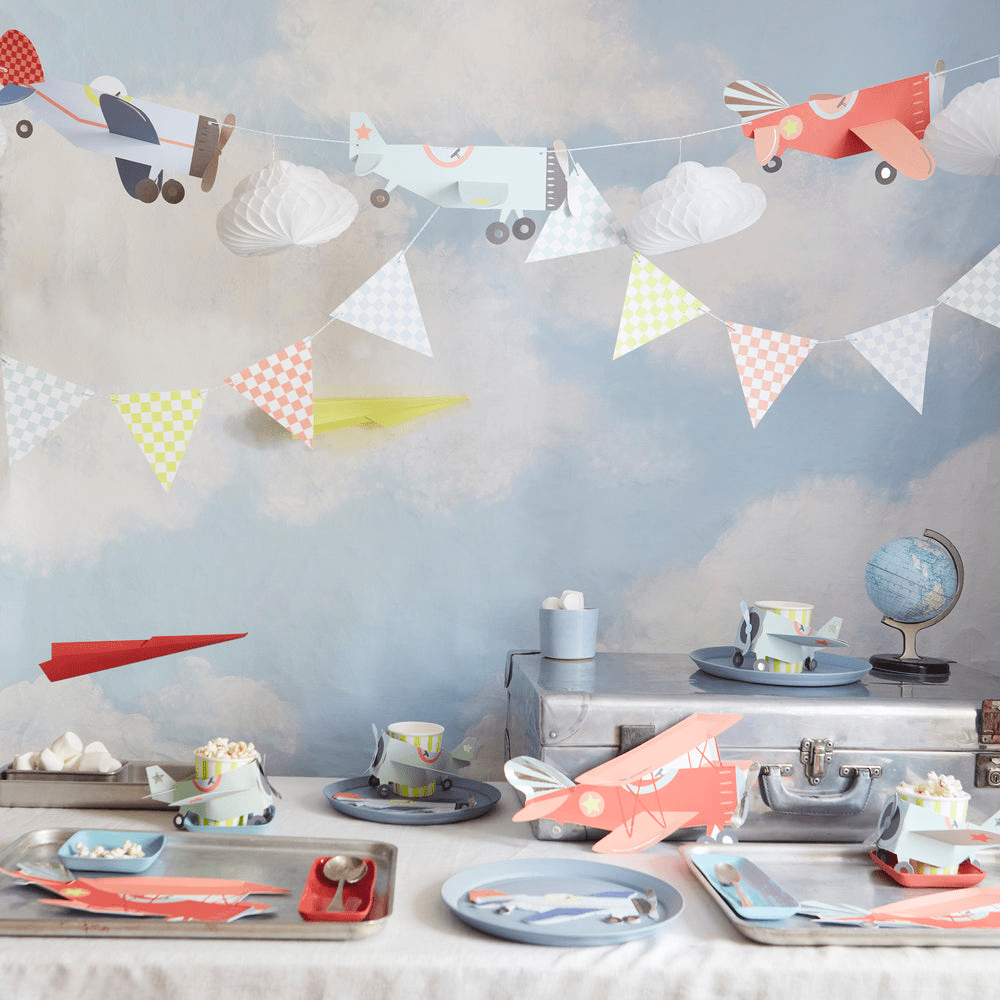 Colorful airplane themed tableware and banners for kids birthday from Parte Haus party supply store in Bethesda MD