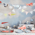 Colorful airplane themed tableware and banners for kids birthday from Parte Haus party supply store in Bethesda MD