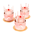 Pink birthday cake shaped favor box with candles and red pom from Parte Haus party supply store in Bethesda Maryland