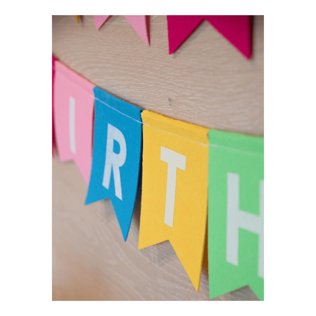 Colorful birthday banner with cutout letters for birthday theme from Parte Haus party supply store in Bethesda Maryland