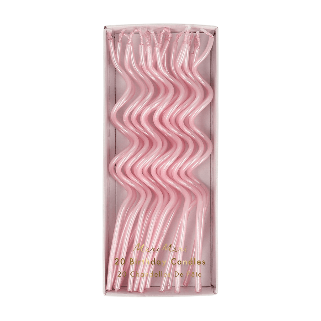 Pink wavy birthday candles in a box for birthday from Parte Haus party supply store in Bethesda Maryland