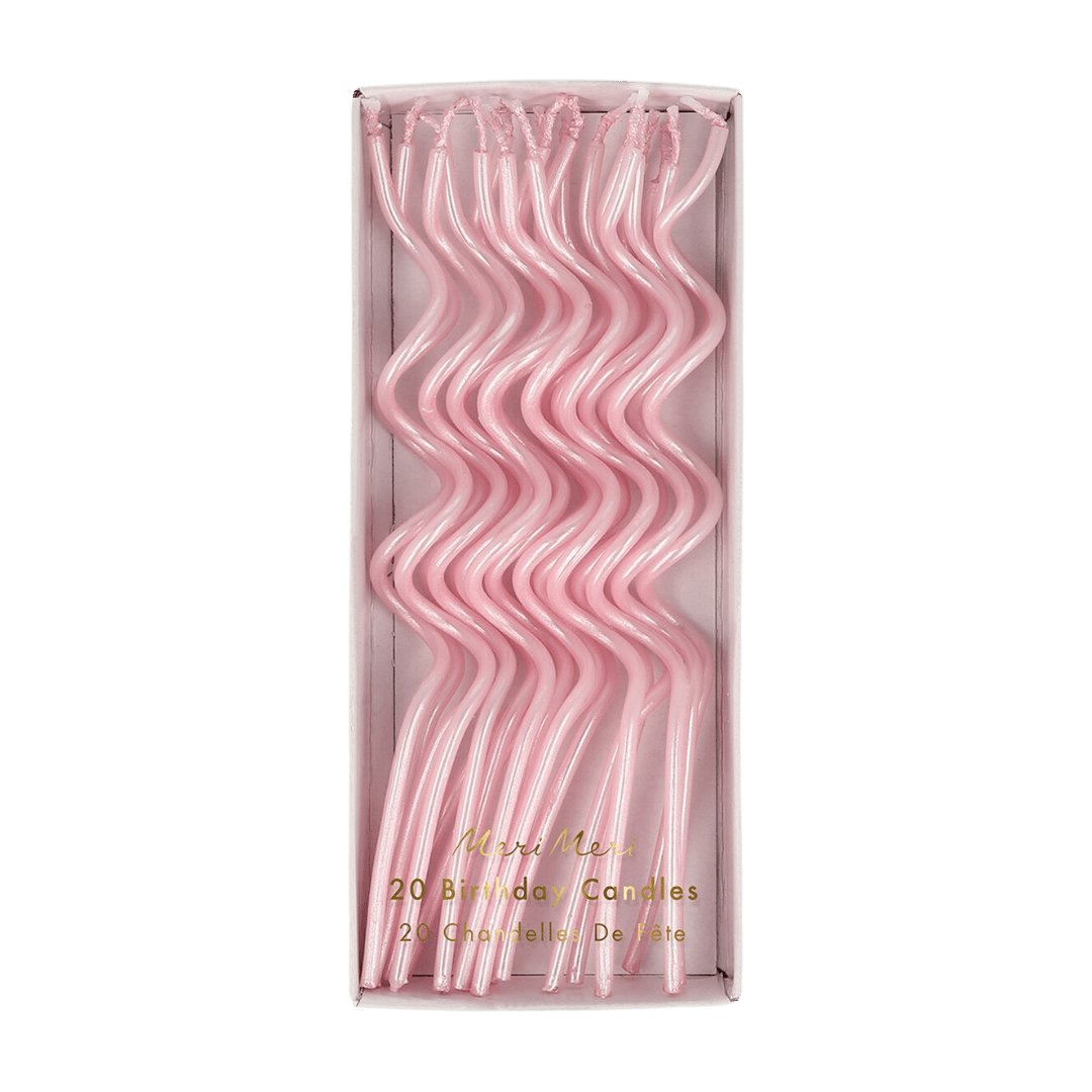 Pink wavy birthday candles in a box for birthday from Parte Haus party supply store in Bethesda Maryland
