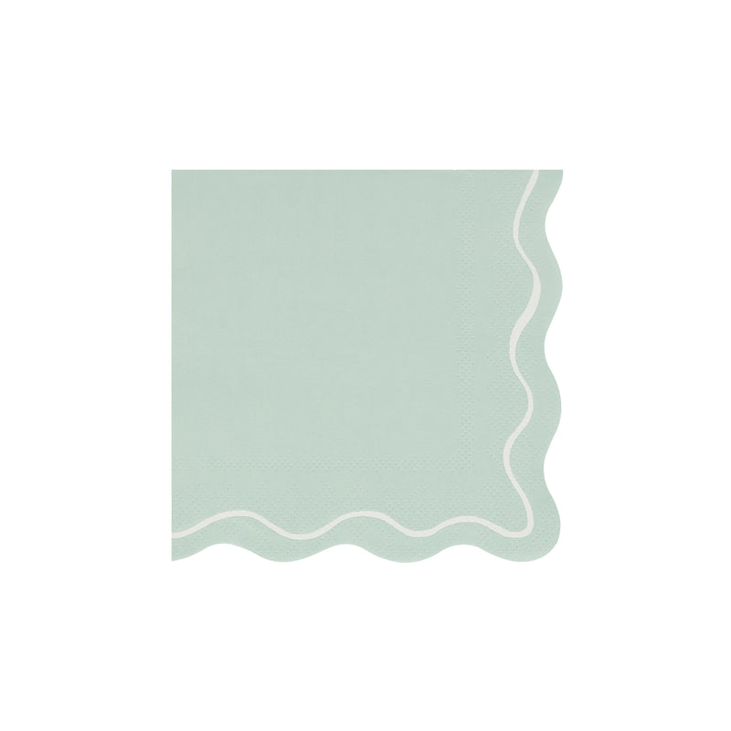 Mint green napkin with scalloped edges and white wavy border from Parte Haus party supply store in Bethesda MD