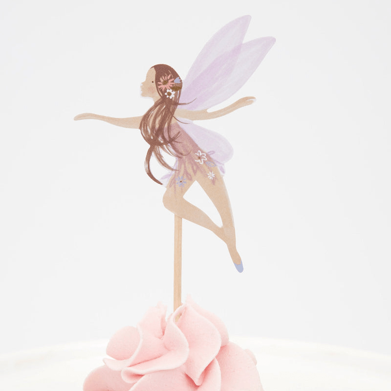 Purple fairy cake topper featuring a delicate fairy on frosting for birthday from Parte Haus party supply store in Bethesda MD