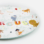Multicolor circus themed paper plate with animal illustrations from Parte Haus party supply store in Bethesda Maryland