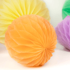 Orange yellow and purple honeycomb paper ball decorations for birthday from Parte Haus party supply store in Bethesda MD.
