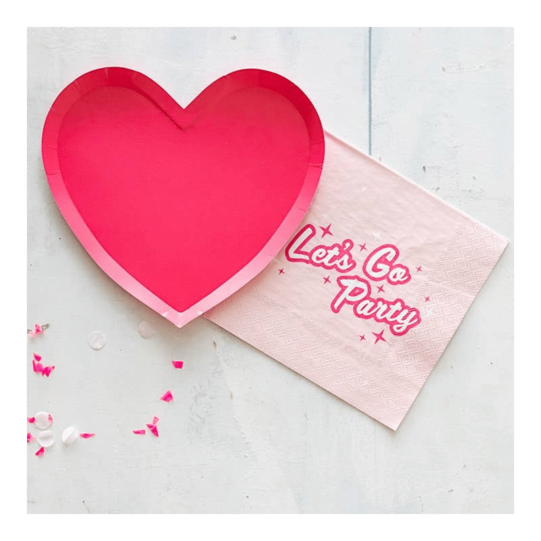 Pink heart plate and Let's Go Party napkin for birthday celebration from Parte Haus party supply store in Bethesda MD