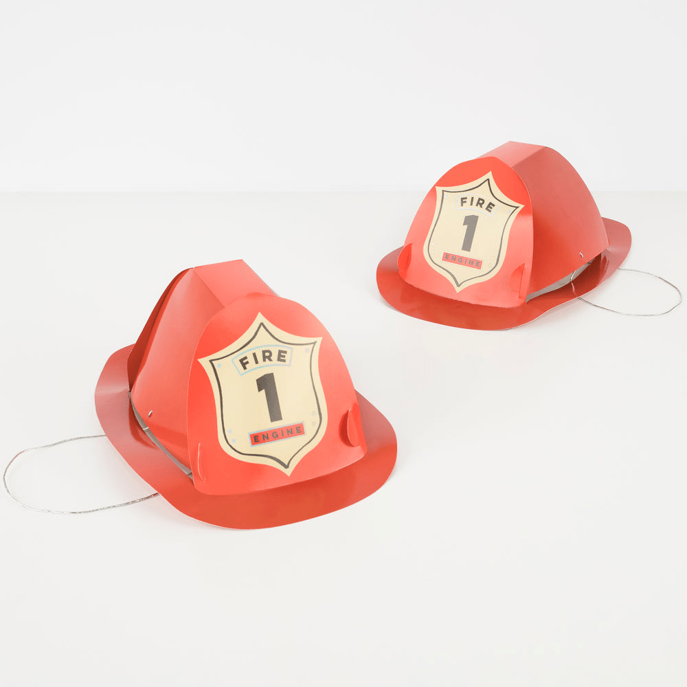 Red firefighter hats with shield badge fire engine theme from Parte Haus party supply store in Bethesda MD