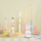 Pastel Easter candles and decorative eggs on table spring holiday from Parte Haus party supply store in Bethesda Maryland